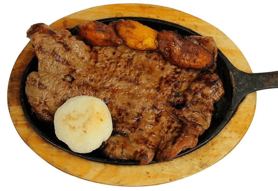 Carne asada acompañada de arepa y plátano maduro