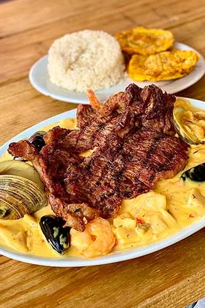 sirloin steak topped with seafood